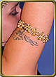 Steel-lace arm band in brass w/Colorful handpiece